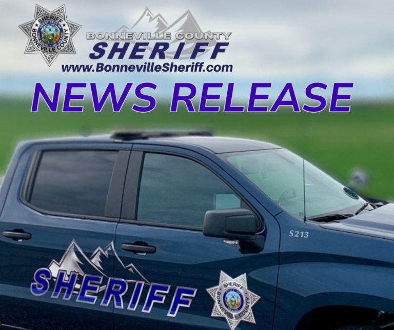 A blue Bonneville County Sheriff vehicle is shown with sheriff logos and mountain graphics. Text above reads: “Bonneville County Sheriff www.BonnevilleSheriff.com NEWS RELEASE” against a blurred outdoor background.