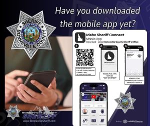 A graphic promoting the Bonneville County Sheriff mobile app features a person using a phone, QR code, app screenshots, sheriff logos, and text asking if users have downloaded the Idaho Sheriff Connect app yet.
